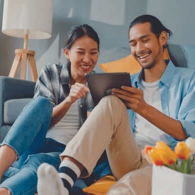 couple planning renovation on tablet